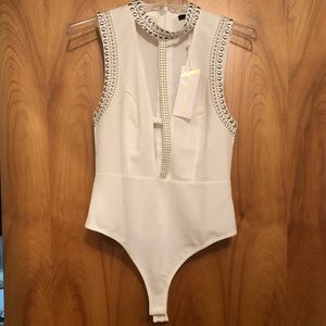 Sleeveless studded white bodysuit